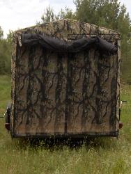 Matching camouflage shoot through screen door.