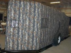 XD3 Camouflage Trailer with screen porch extension.